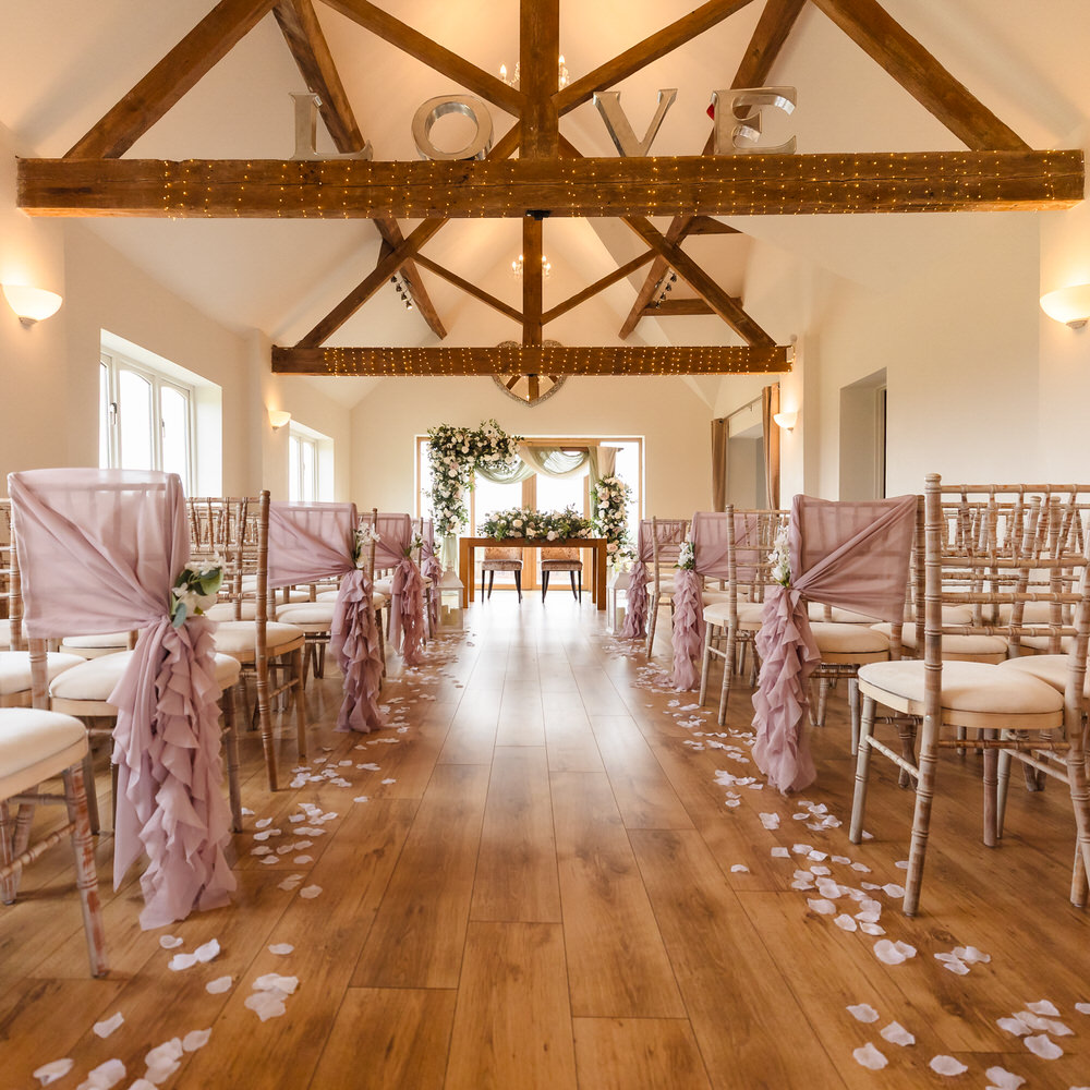 A beautifully set ceremony room at a Worcestershire wedding venue